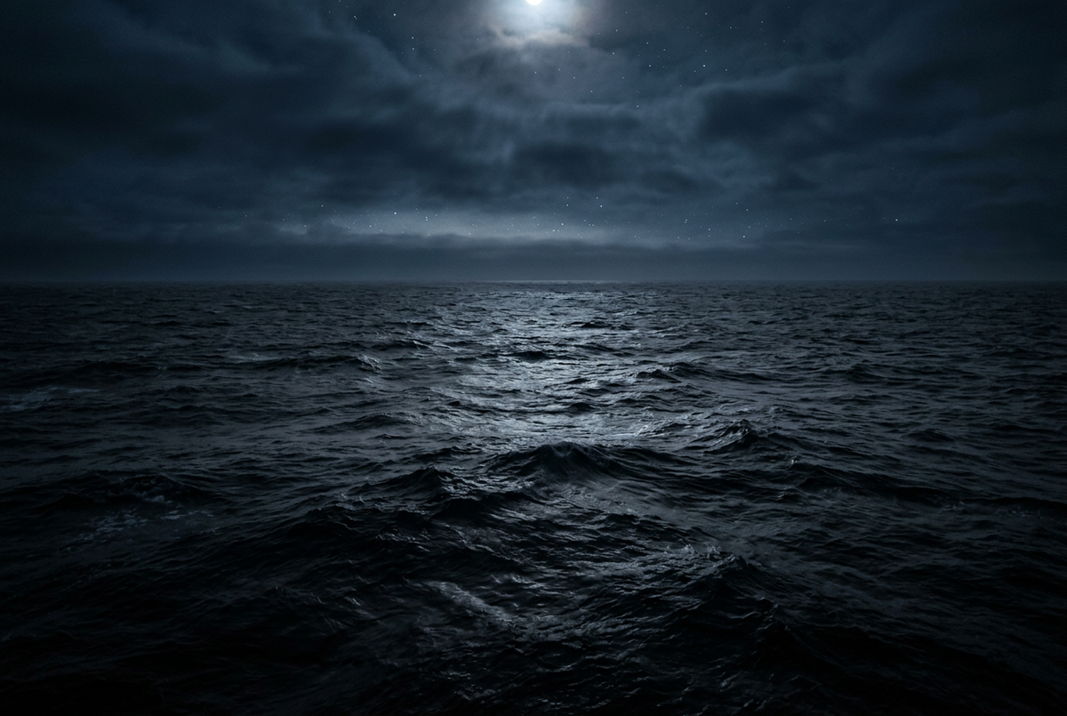 Dark ocean with moonlit waves